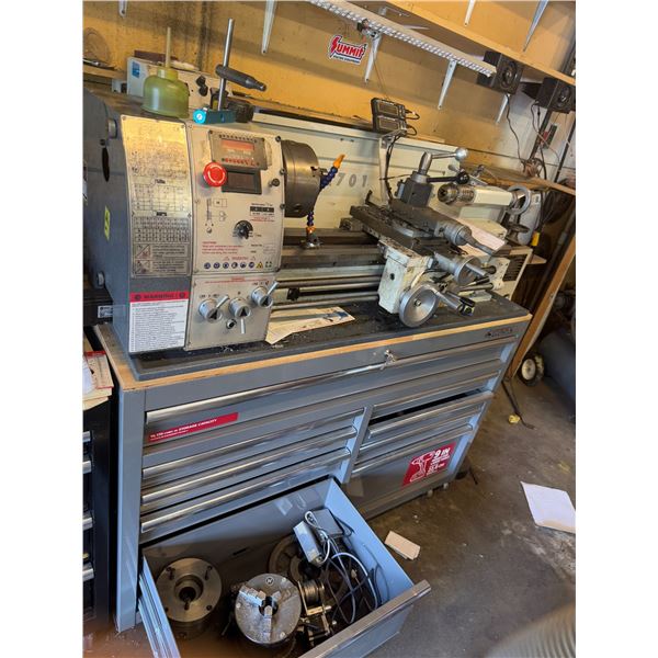 Lathe model CX 701 toolbox is not included, but parts in drawer pictured are