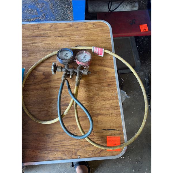Charging hose with gauges