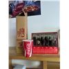 Image 1 : Evolution of the Coca-Cola bottle and bending cups
