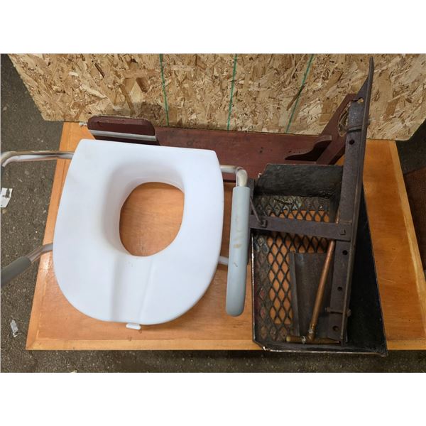 Plastic toilet, scrap metal and wood