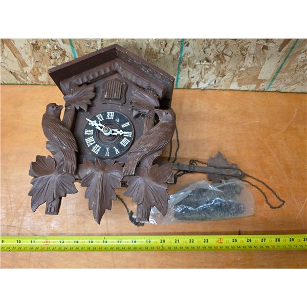 Coco clock with weights