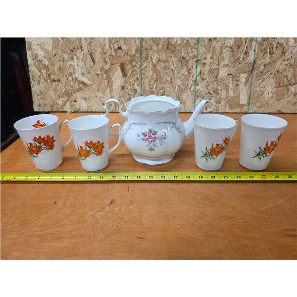 Tea pot and tea cups
