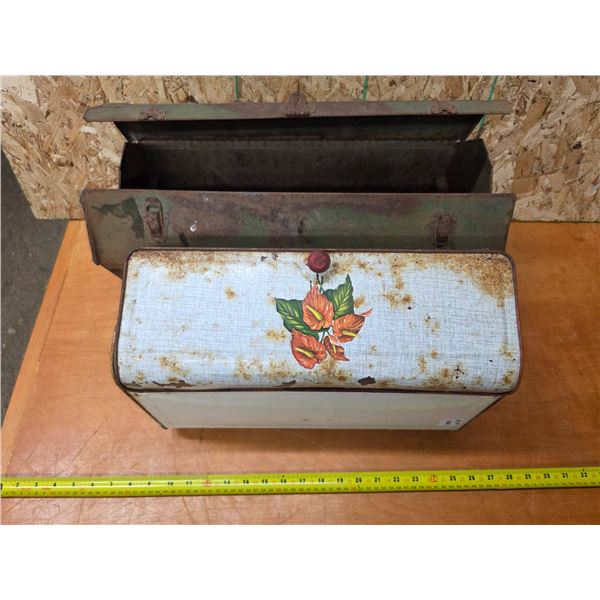 Rusted metal toolbox and storage tin