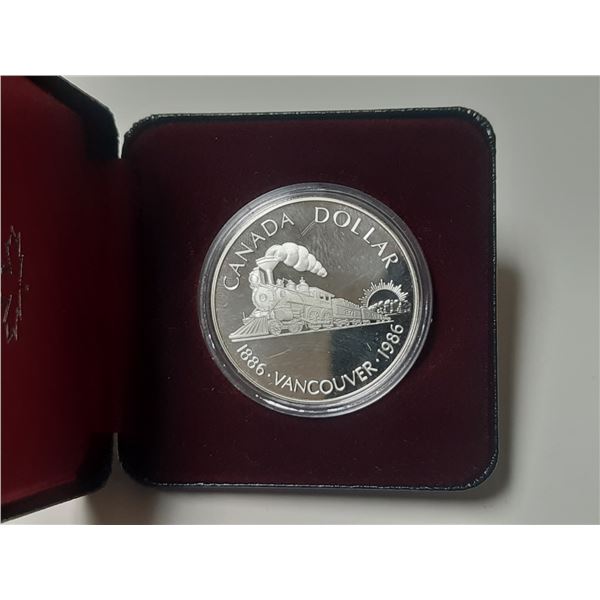 1986 Canadian Proof Silver Dollar commemorating the 100th anniversary of Vancouver and the Transcont