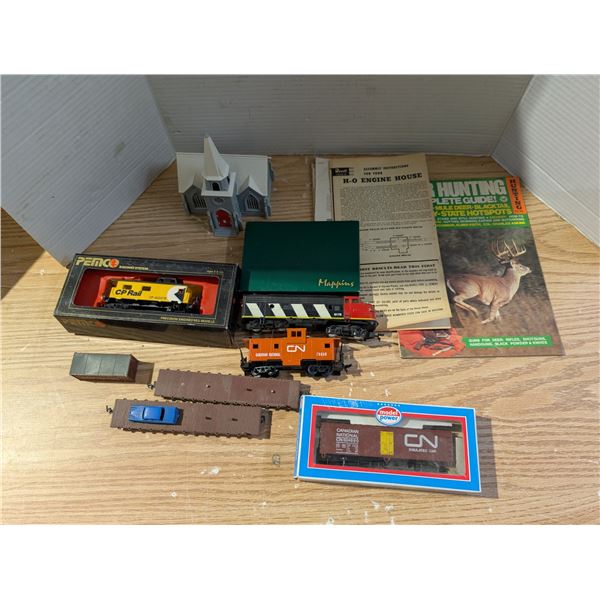 Box full of Misc. Train Items (Trains, Old Papers of Trains, Houses, and etc.)