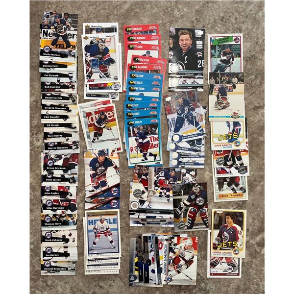 894 - Winnipeg Jets lot of 65 different hockey cards. Mixed brands. Mixed years.