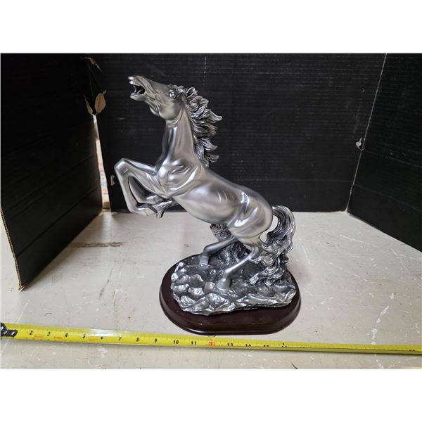 Silver colored bucking horse
