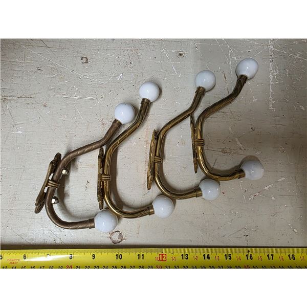 4 gold colored coat hangers