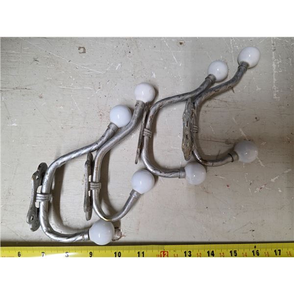4 silver colored coat hangers