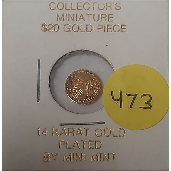 Tiny Replica of U.S. $20 gold coin. Replica has been 14 karat gold plated.
