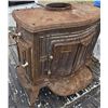 Image 1 : Cast iron wood burning stove- needs some work