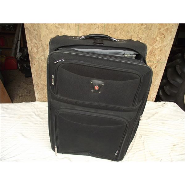 Swiss Gear suit case. Very nice clean shape with wheels and extendable tow handle.