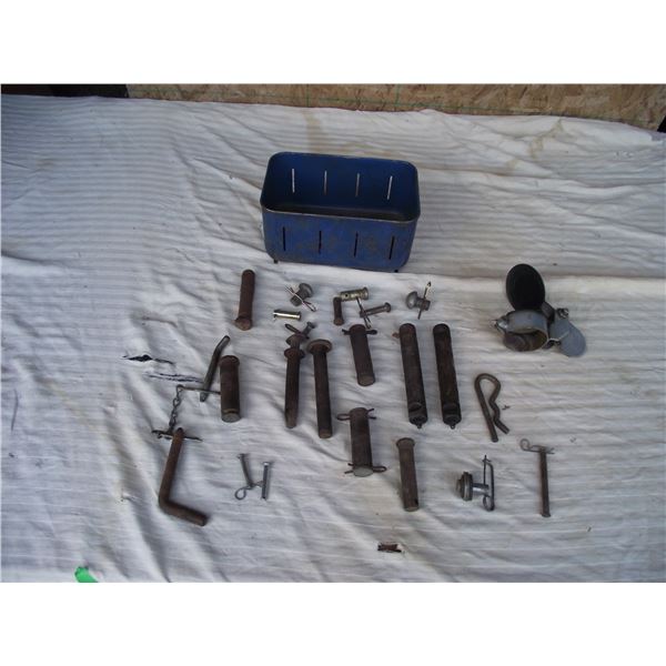 Assorted keyed pins and muffler cap.