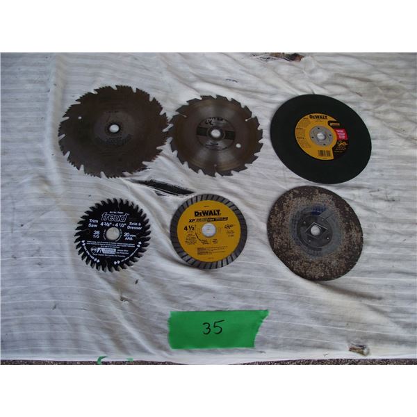 Assorted saw blades and cutting discs, mostly new.