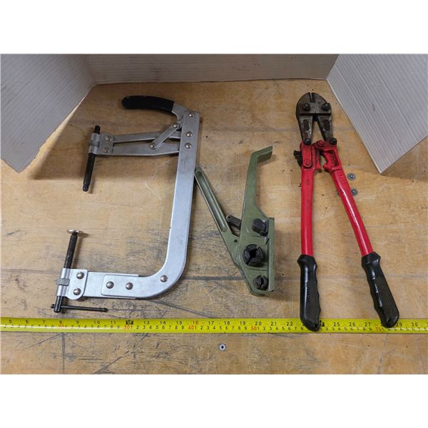 Green Bander and bolt cutter and a valve spring tool