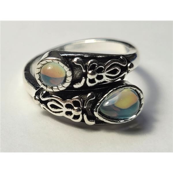 30)  ROCK CRYSTAL FREE SIZE BY-PASS RING,