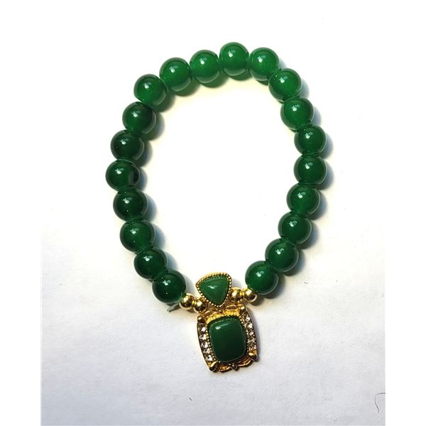 28)  GREEN JADE COLORED BRACELET WITH GOLD