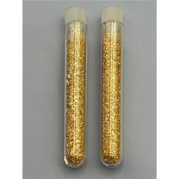 Two Plastic Test Tubes Containing Golden Metallic Flakes