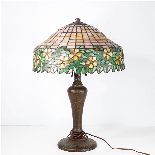 Vintage 16" floral leaded lamp on ornate base.