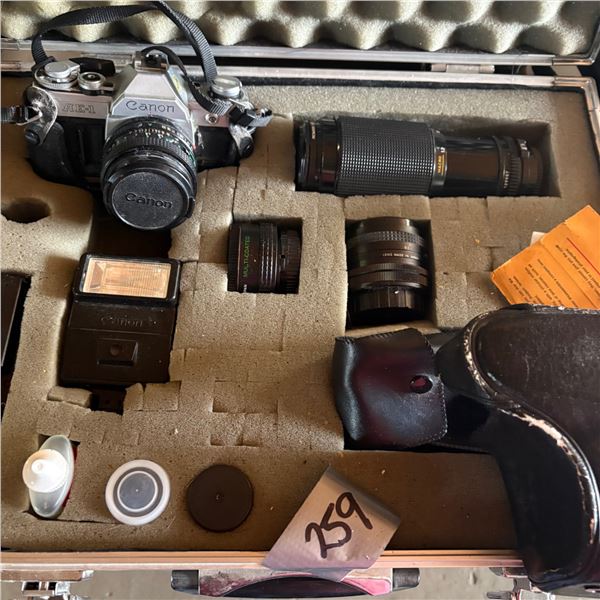 VINTAGE CANON AE-1 35 MM SINGLE-LENS REFLEX CAMERA WITH METAL CARRY CASE