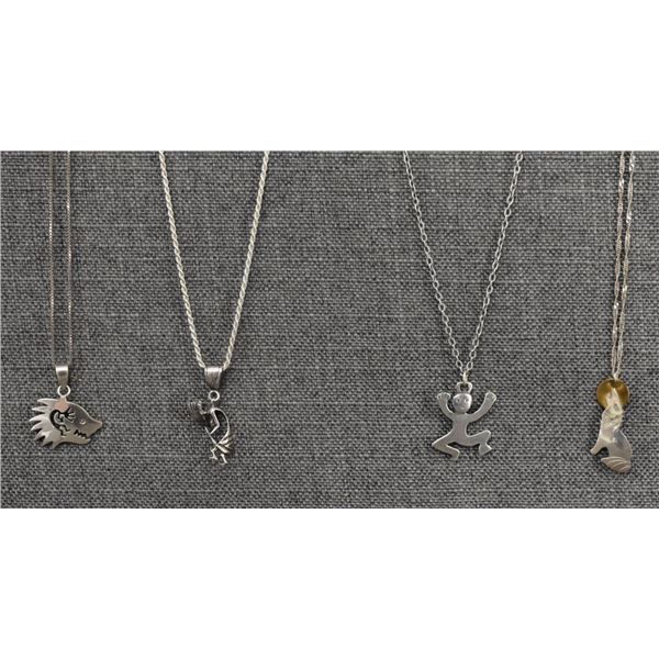 FOUR HOPI STERLING SILVER PENDANTS
