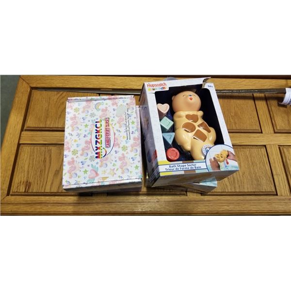 2 NEW CASES OF MERMAID LOLLIPOPS, CASE OF FRUIT SLICE CANDY, AND 2 KIDS SORTER TOYS