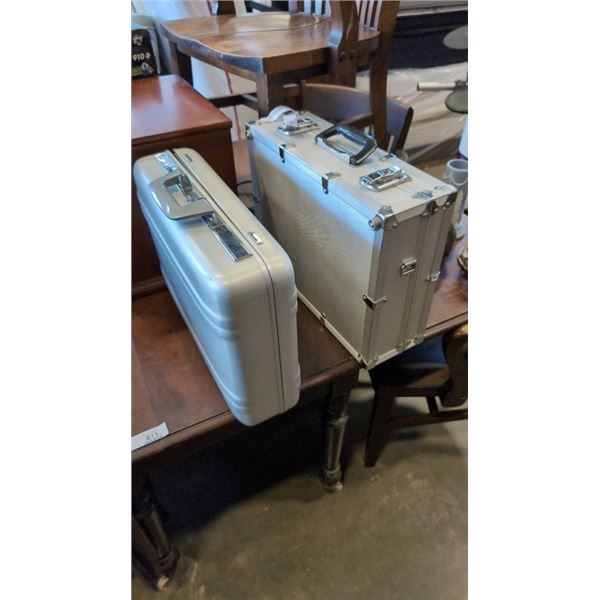 2 METAL BRIEFCASES, ONE HAS POWER BAR