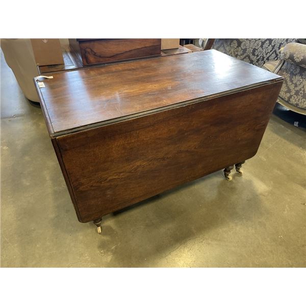ANTIQUE DROP LEAF DINING TABLE ON CASTERS