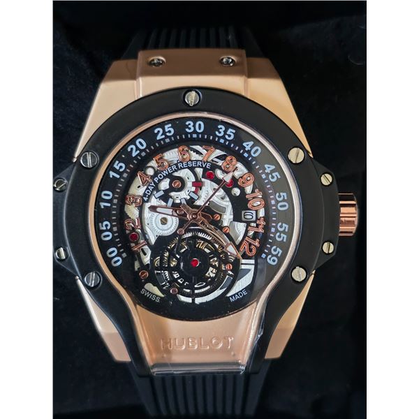 NEW Q. HUBLOT SKELETON FACE REPLICA WATCH. ROSE GOLD CASE. MULTI-COLOR DIAL. BLUE RUBBER FLEX STRAP.