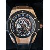 Image 1 : NEW Q. HUBLOT SKELETON FACE REPLICA WATCH. ROSE GOLD CASE. MULTI-COLOR DIAL. BLUE RUBBER FLEX STRAP.