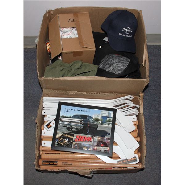 TWO BOXES OF "MERCH" INCLUDING T-SHIRTS, HATS,