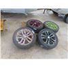 Image 1 : Set of (4) P215/55R17 Tires on Nissan Rims. 