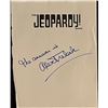 Image 1 : Alex Trebek Signed Jeopardy page from The Jeopardy! Book.