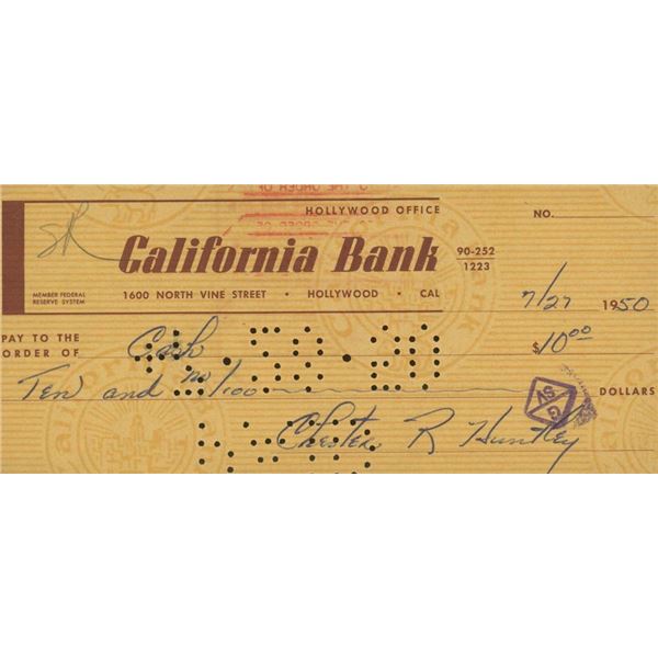 Evening News Anchor Chester Huntley signed check