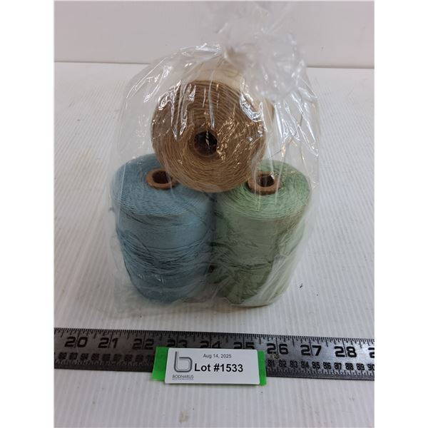 .(4) Spools of Blue/Green/Brown Yarn