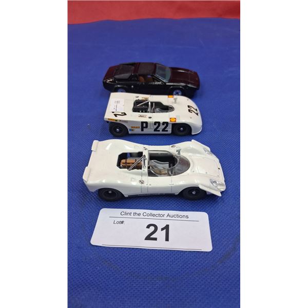 3 1:43 scale die cast race cars