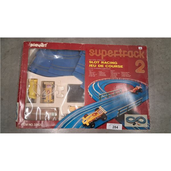 Vintage battery operated slot racing course, box is 20"x16"