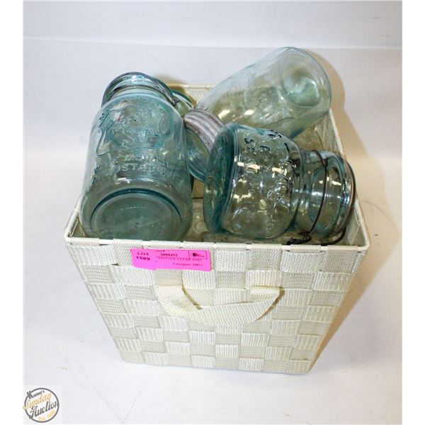 BASKET OF VINTAGE CLEAR AND BLUE JARS