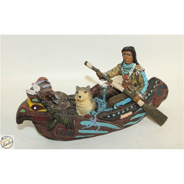 NORTH AMERICAN ABORIGINAL ON CANOE FIGURINE