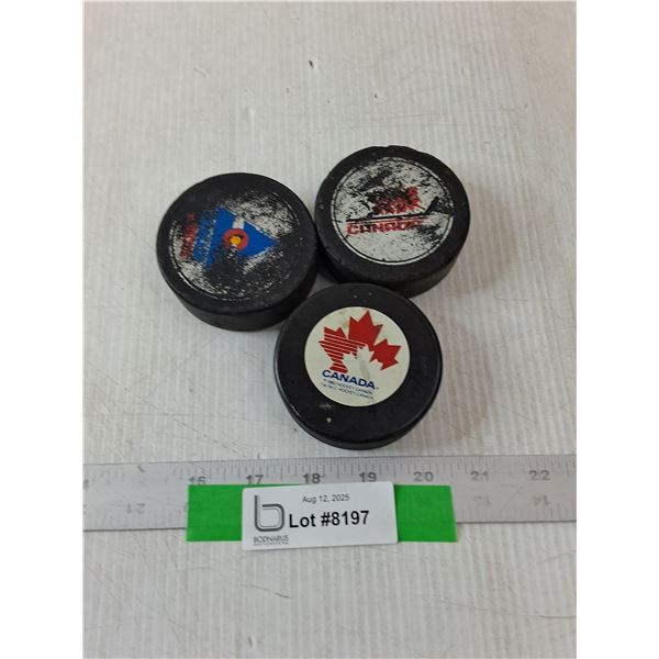 (3) Hockey Pucks