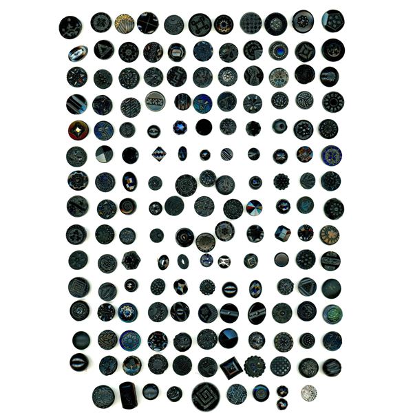 A card of old black glass buttons