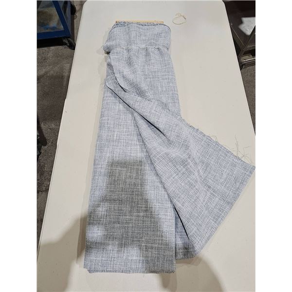 Gray and White Patterned Fabric in Folded Condition