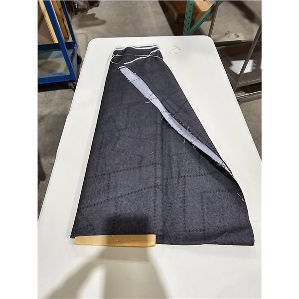 Bolt of Blue Denim Fabric on Wooden Spool