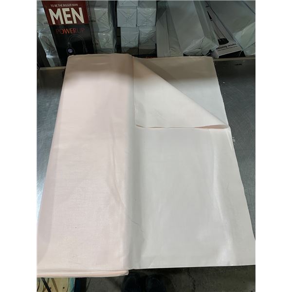 Pink and White Folded Fabric Sheets