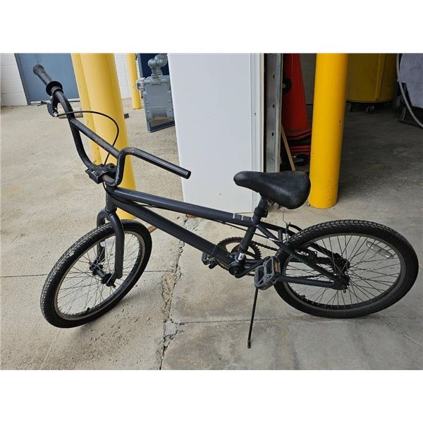 BMX-Style Bicycle With Black Frame And Chain Drive System