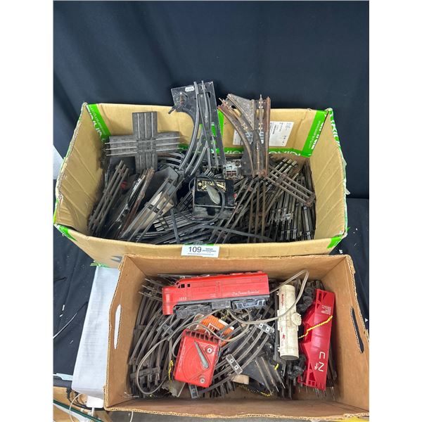 3 Boxes of O Scale Train Tracks + Locomotive and Other Cars