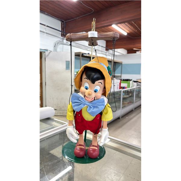 DISNEY CLASSIC PINOCCHIO ON A METAL STAND