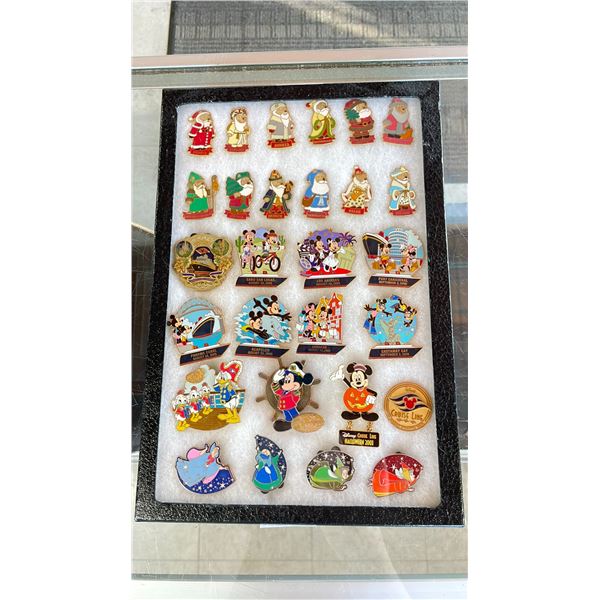 ASSORTED DISNEY PINS IN A CASE