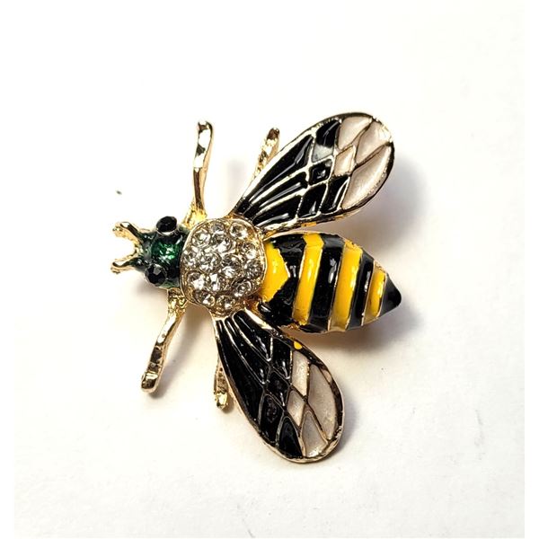 25)  GOLD TONE WITH GREEN, BLACK, YELLOW &