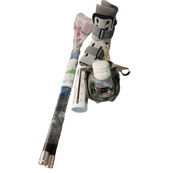 Medical props including walking boots, neck brace, and accessories